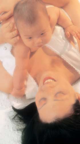 Asian mother with newborn