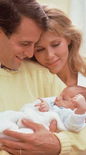 Parents holding newborn