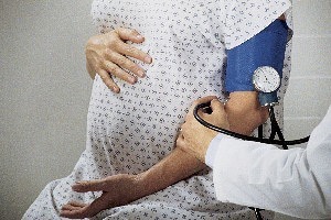 Pregnant mom having blood pressure checked