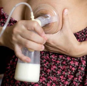 Mother pumping breast milk