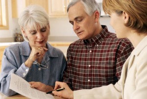 Couple talking with benefits manager