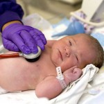 Newborn getting check up at birth