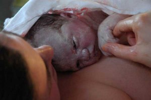 Mom with newborn covered with vernix