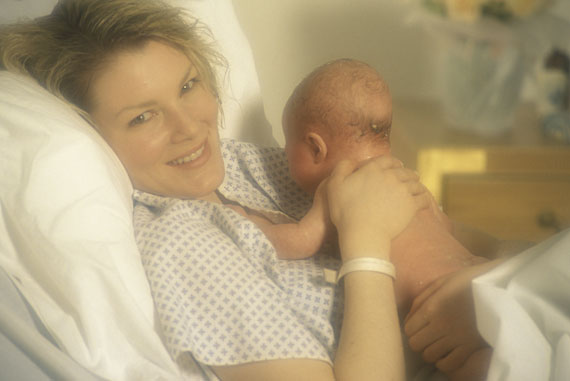 Mother holding newborn just after birth