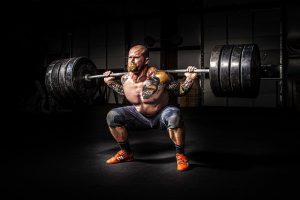 man doing squat lift